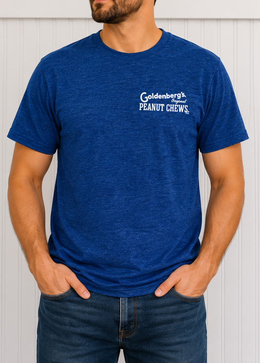 Male model wearing the GOLDENBERG’S® PEANUT CHEWS® Philly Born & Raised Skyline Barcode Tee featuring the classic front chest logo on a royal blue unisex T-shirt.