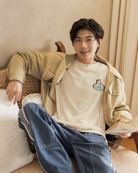 Man wearing the Goody® Since 1923 Tee featuring a vintage Goody candy logo on a comfortable unisex graphic t-shirt.