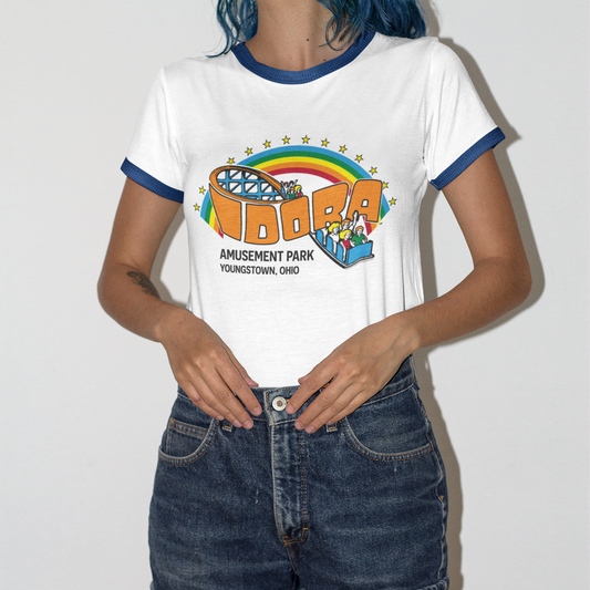 Female model wearing a Limited Edition Idora Park Rainbow Ringer Tee with blue trim and colorful retro amusement park design.