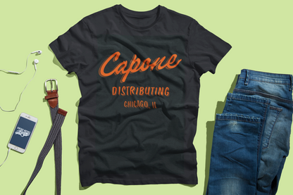 Vintage Al Capone SMVT Exclusive graphic featuring Capone Distributing lettering and Chicago, Illinois typography in bold orange on a black background.