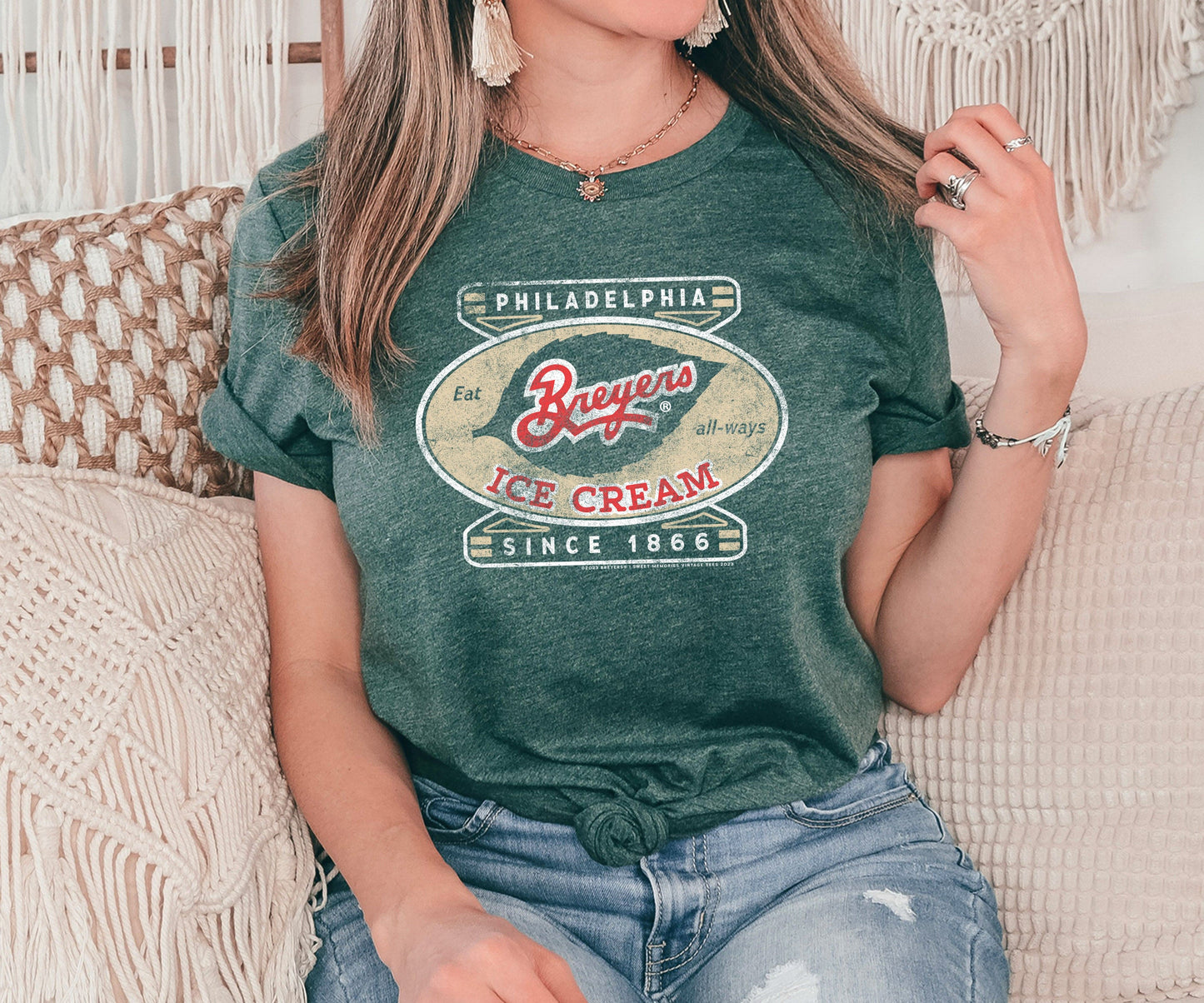 Woman wearing a Breyers Ice Cream Philadelphia Since 1866 Vintage Unisex Tee featuring nostalgic ice cream branding and retro graphics.