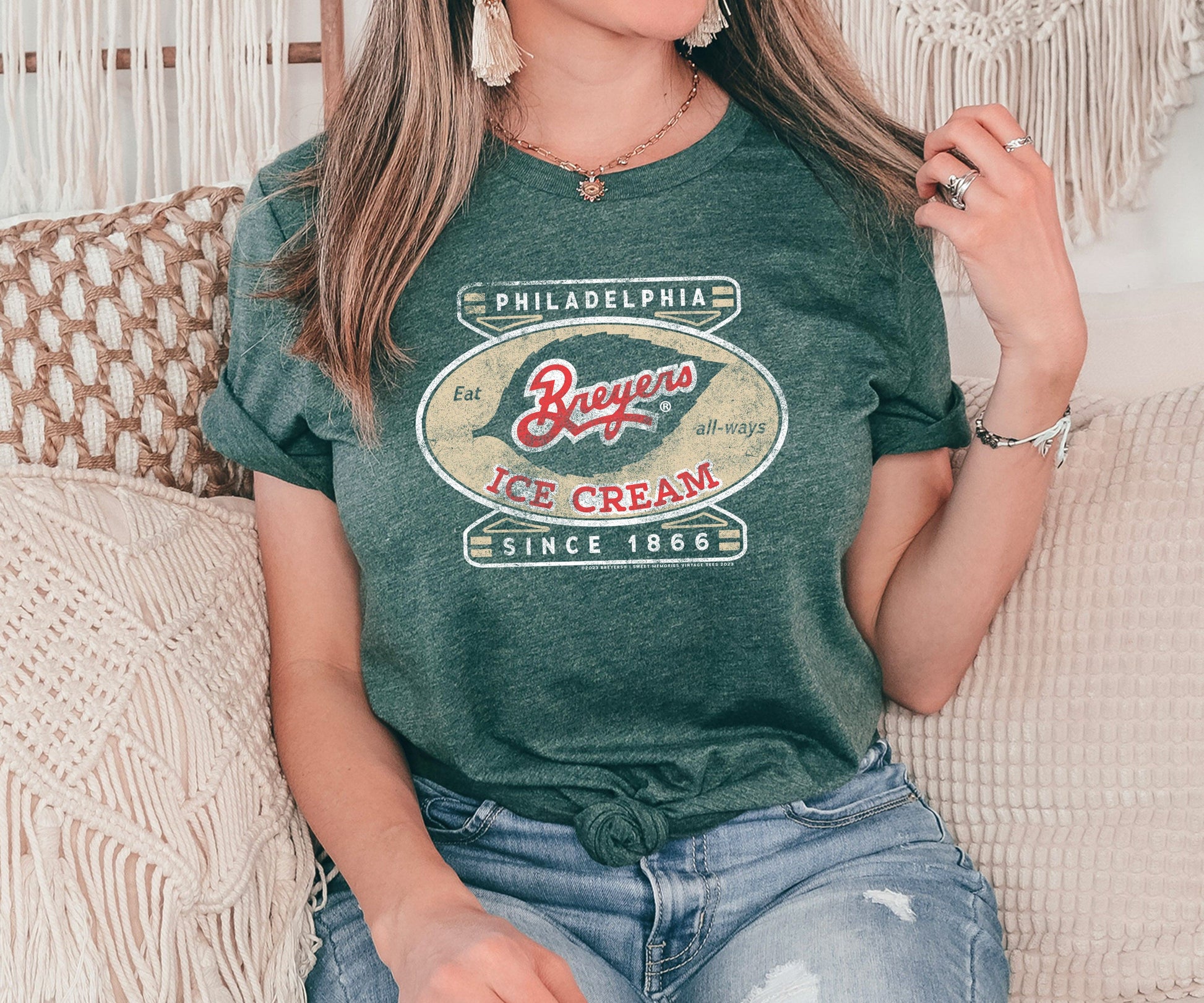 Woman wearing a Breyers Ice Cream Philadelphia Since 1866 Vintage Unisex Tee featuring nostalgic ice cream branding and retro graphics.