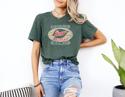 Woman wearing a Breyers Ice Cream Philadelphia Since 1866 Vintage Unisex Tee featuring nostalgic ice cream branding and retro graphics.