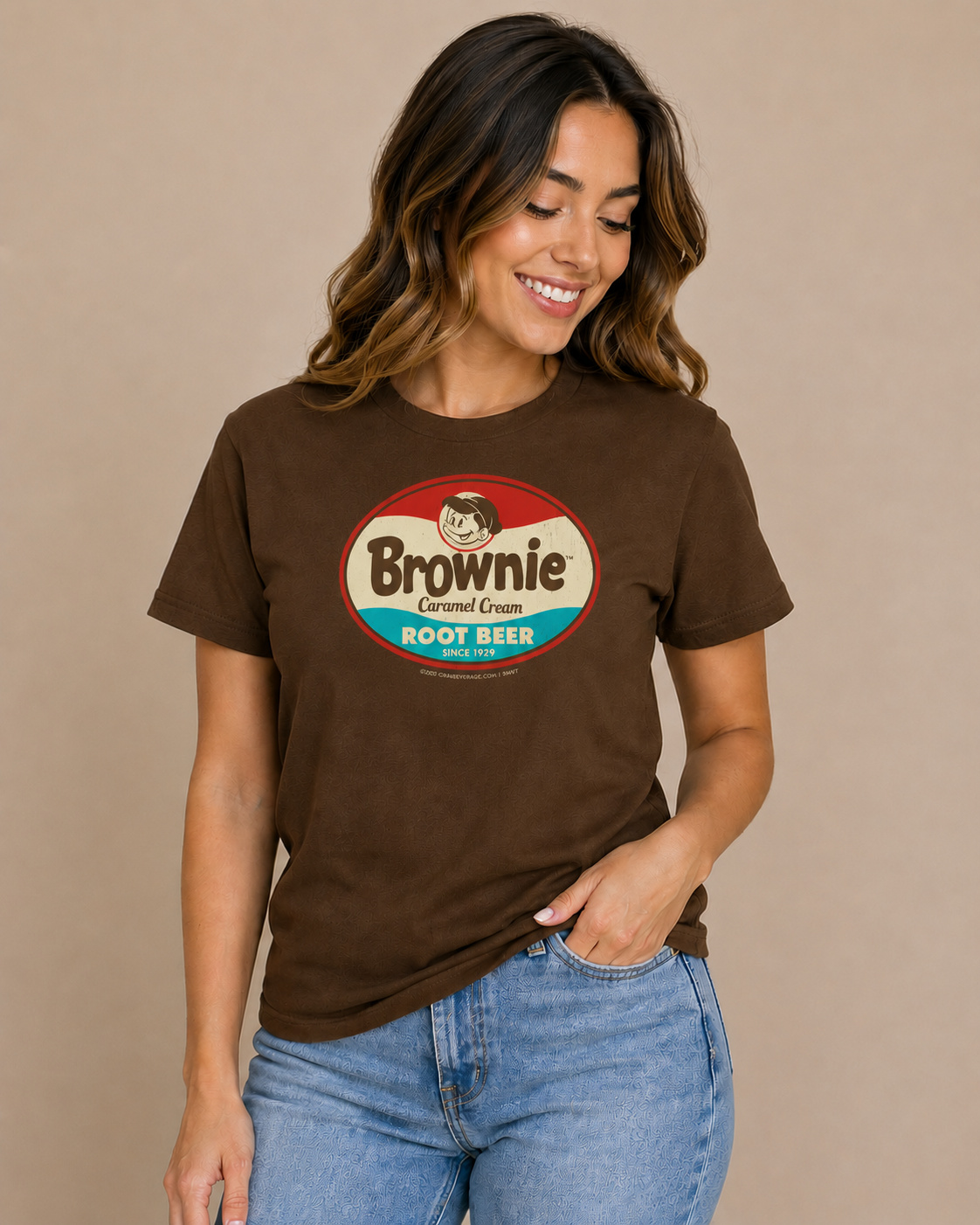 Woman wearing the Brownie™ Caramel Cream Root Beer Tee featuring a vintage Brownie™ root beer graphic on a unisex T-shirt.