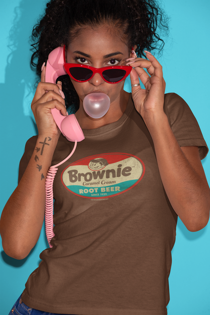 Woman wearing the Brownie™ Caramel Cream Root Beer Tee featuring a vintage Brownie™ root beer graphic on a unisex T-shirt.