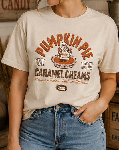 Female model wearing the Goetze's Pumpkin Pie Caramel Creams graphic T-shirt styled for fall, pumpkin season, and Thanksgiving.