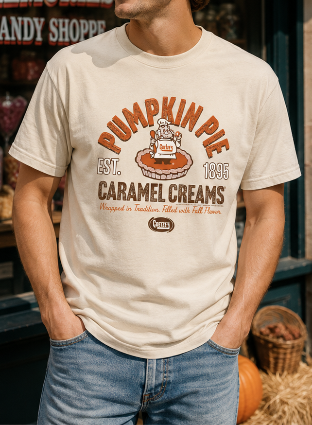 Male model wearing the Goetze's Pumpkin Pie Caramel Creams graphic T-shirt in natural cream for a casual fall look.
