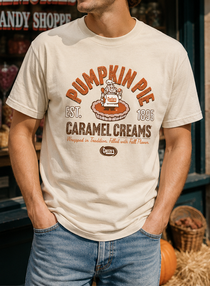 Male model wearing the Goetze's Pumpkin Pie Caramel Creams graphic T-shirt in natural cream for a casual fall look.