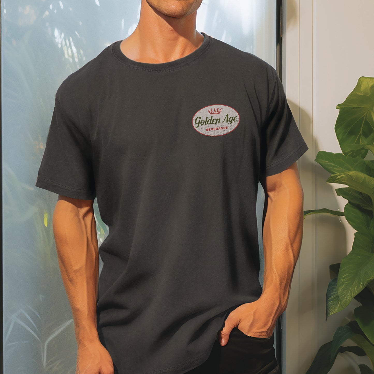 Male model wearing the Golden Age Legacy Tee vintage unisex graphic T-shirt featuring the classic Golden Age heritage logo.