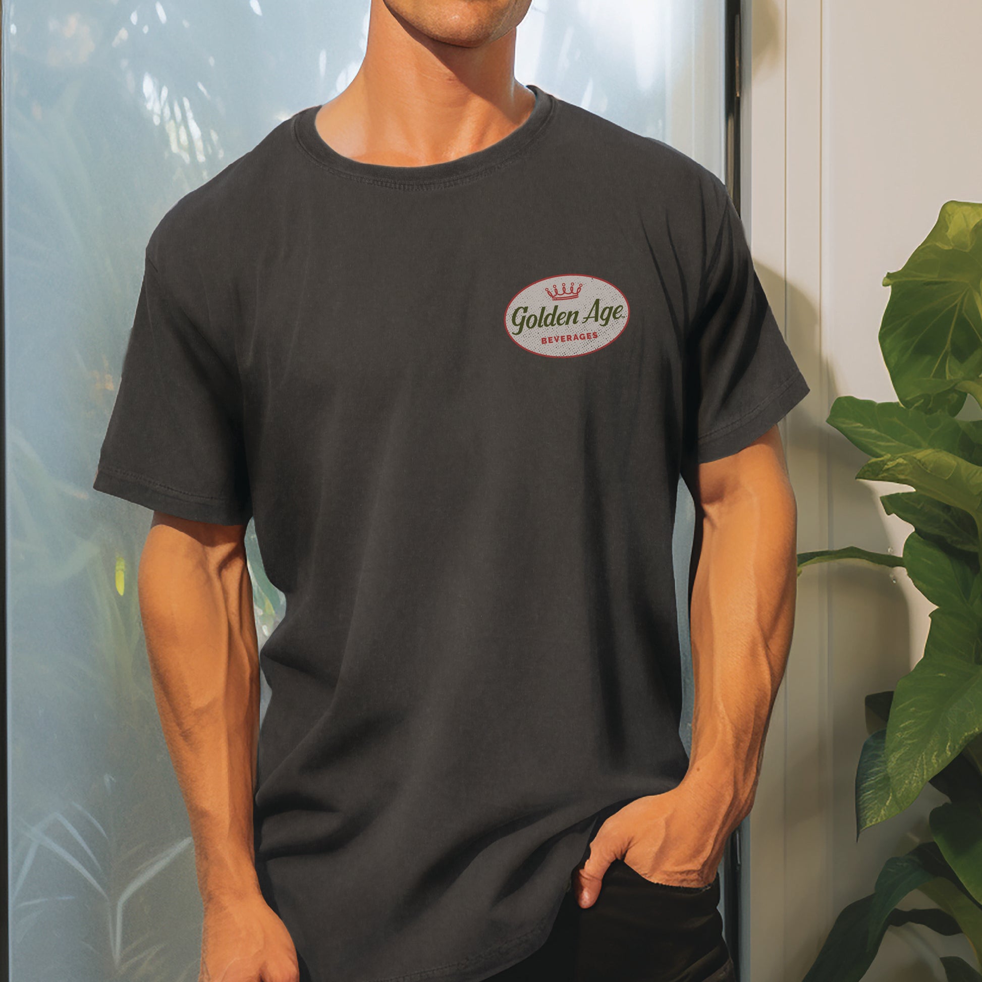 Male model wearing the Golden Age Legacy Tee vintage unisex graphic T-shirt featuring the classic Golden Age heritage logo.