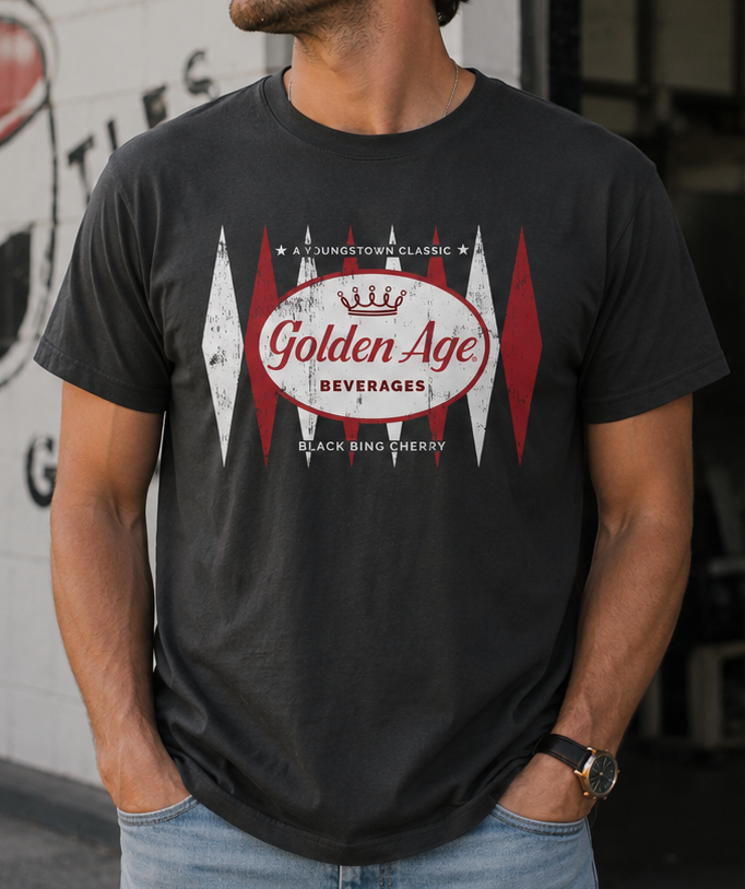 Man wearing the Golden Age Retro Black Bing Cherry Logo vintage soda unisex graphic T-shirt with a distressed retro-inspired design.