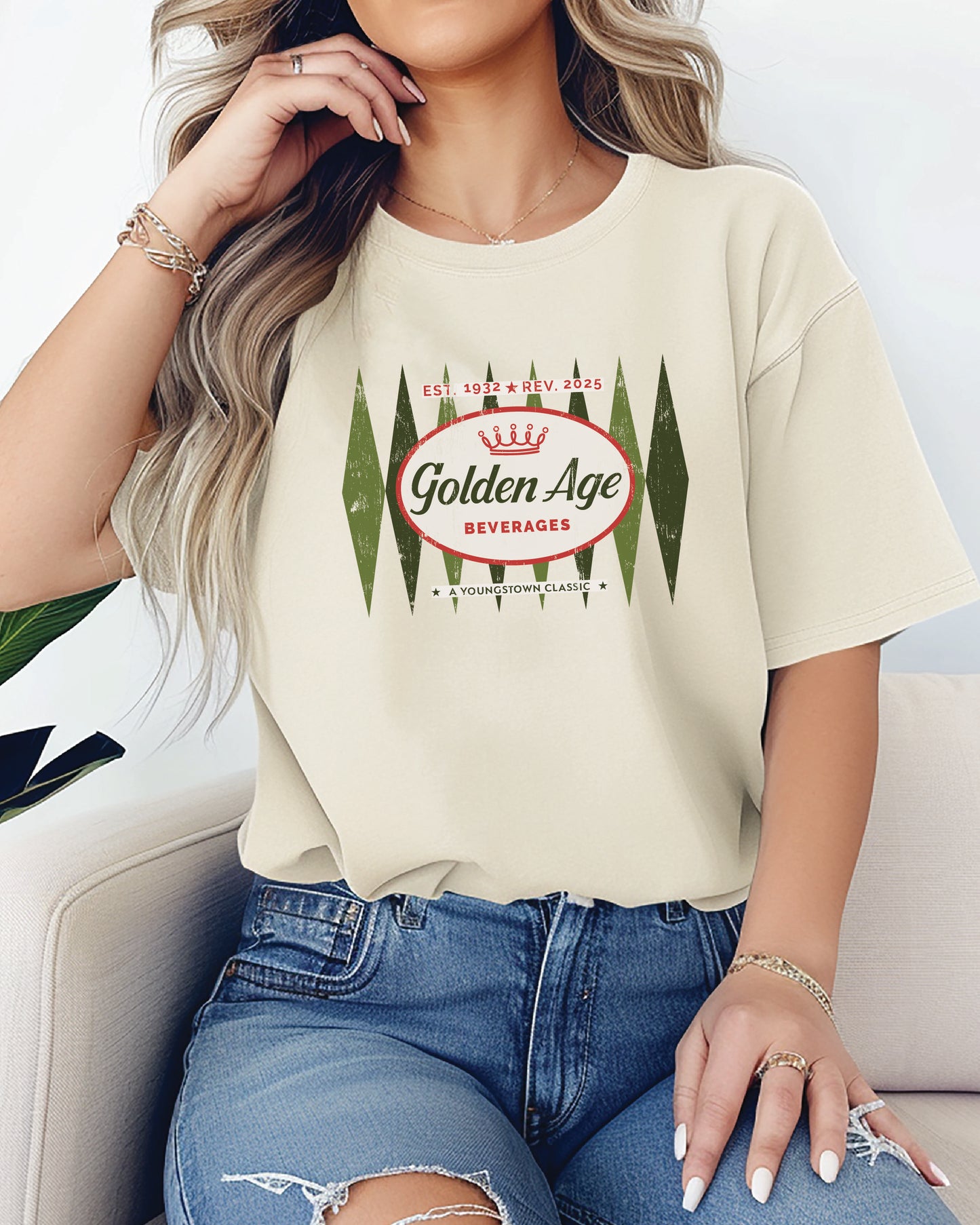 Female model wearing the Golden Age Retro Logo Tee vintage soda unisex graphic T-shirt featuring the nostalgic Golden Age logo.