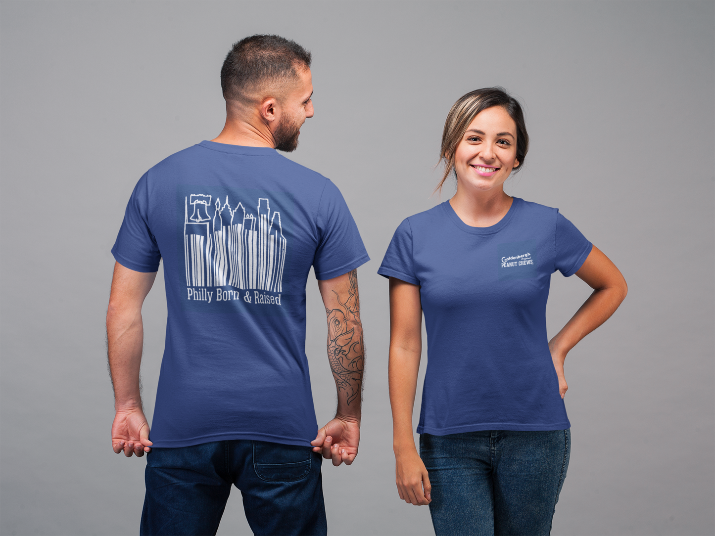 GOLDENBERG’S® PEANUT CHEWS® Philly Born & Raised Skyline Barcode Tee featuring a small front chest logo and large Philadelphia skyline barcode graphic on the back of a royal blue unisex T-shirt.