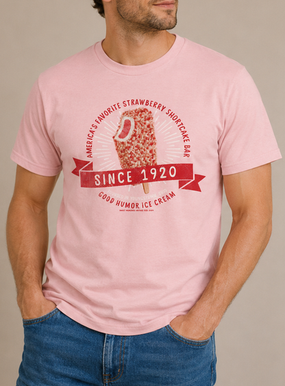 Man wearing a Good Humor™ Ice Cream Strawberry Shortcake 1920 Tee showcasing a vintage strawberry shortcake ice cream bar design.