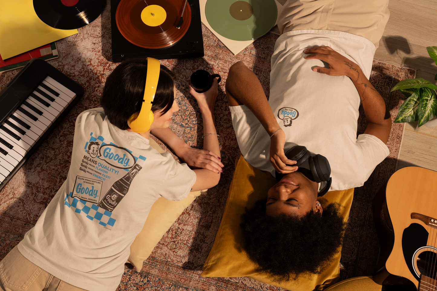 Two people wearing the Goody® Since 1923 Tee featuring a vintage Goody candy logo on a soft unisex graphic t-shirt.