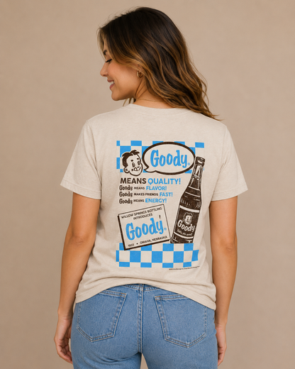 Woman wearing the Goody® Since 1923 Tee featuring a vintage candy logo on a casual unisex graphic t-shirt.
