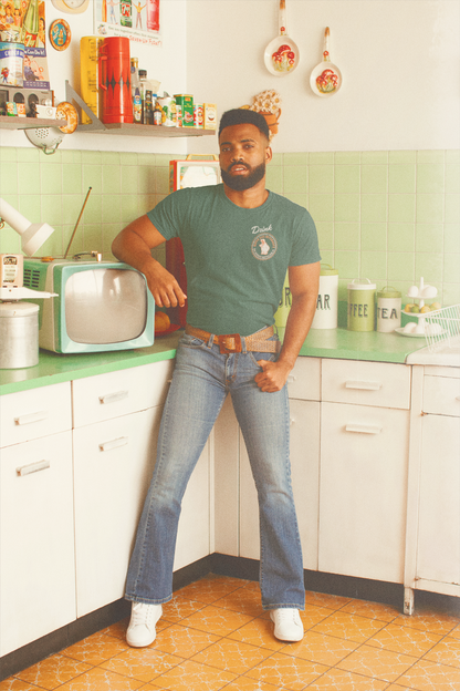 Man wearing the Hippo Size® Beverage – Texan Size Drink Tee chest graphic inspired by vintage Texas soft drink advertising.