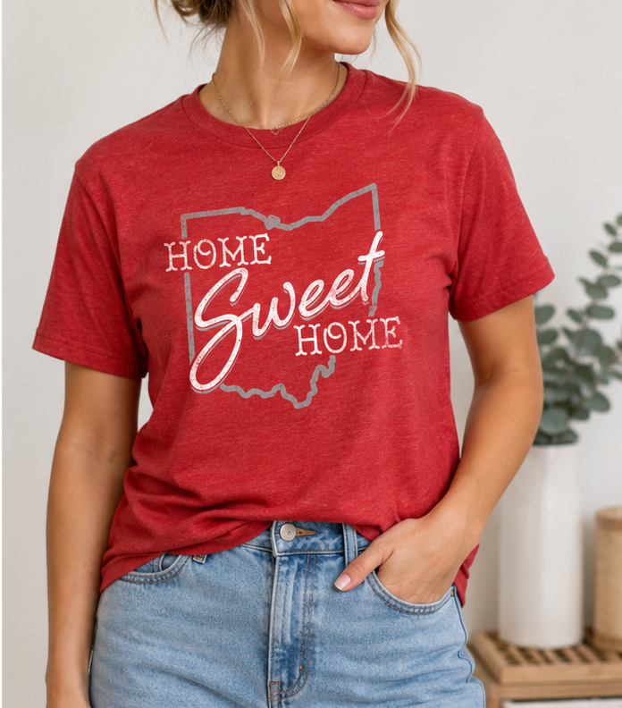 Woman wearing the Home Sweet Home Ohio Pride unisex graphic T-shirt featuring a vintage Ohio-inspired design.