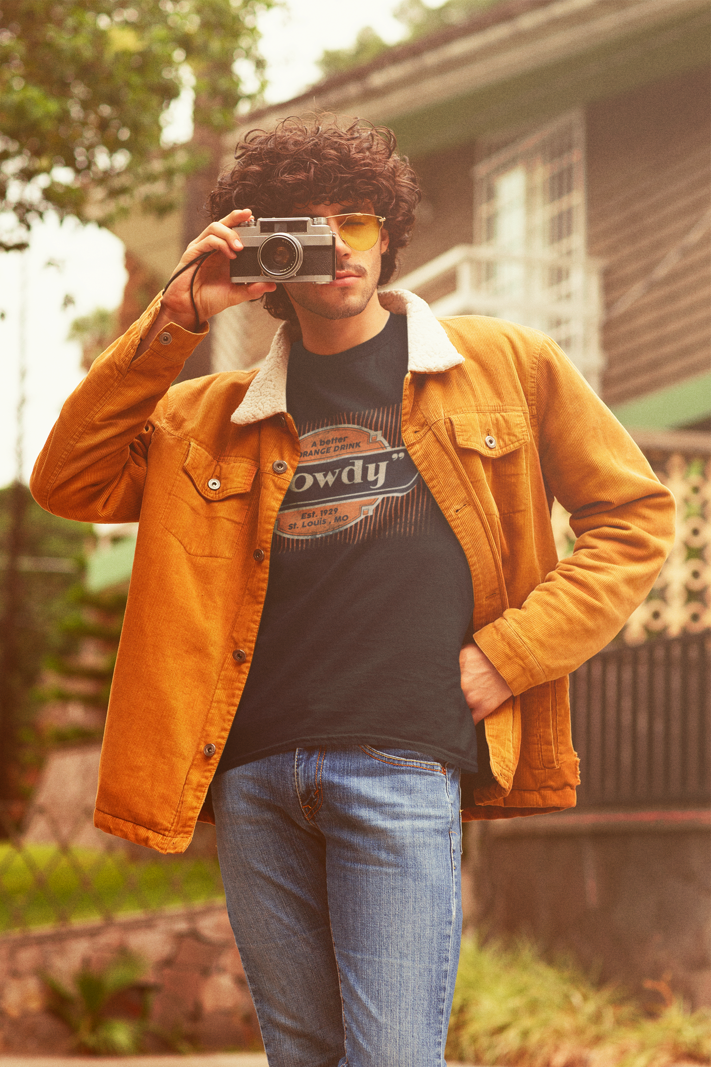Man wearing the Howdy® A Better Orange Drink Tee featuring a vintage retro orange soda graphic on a unisex T-shirt.
