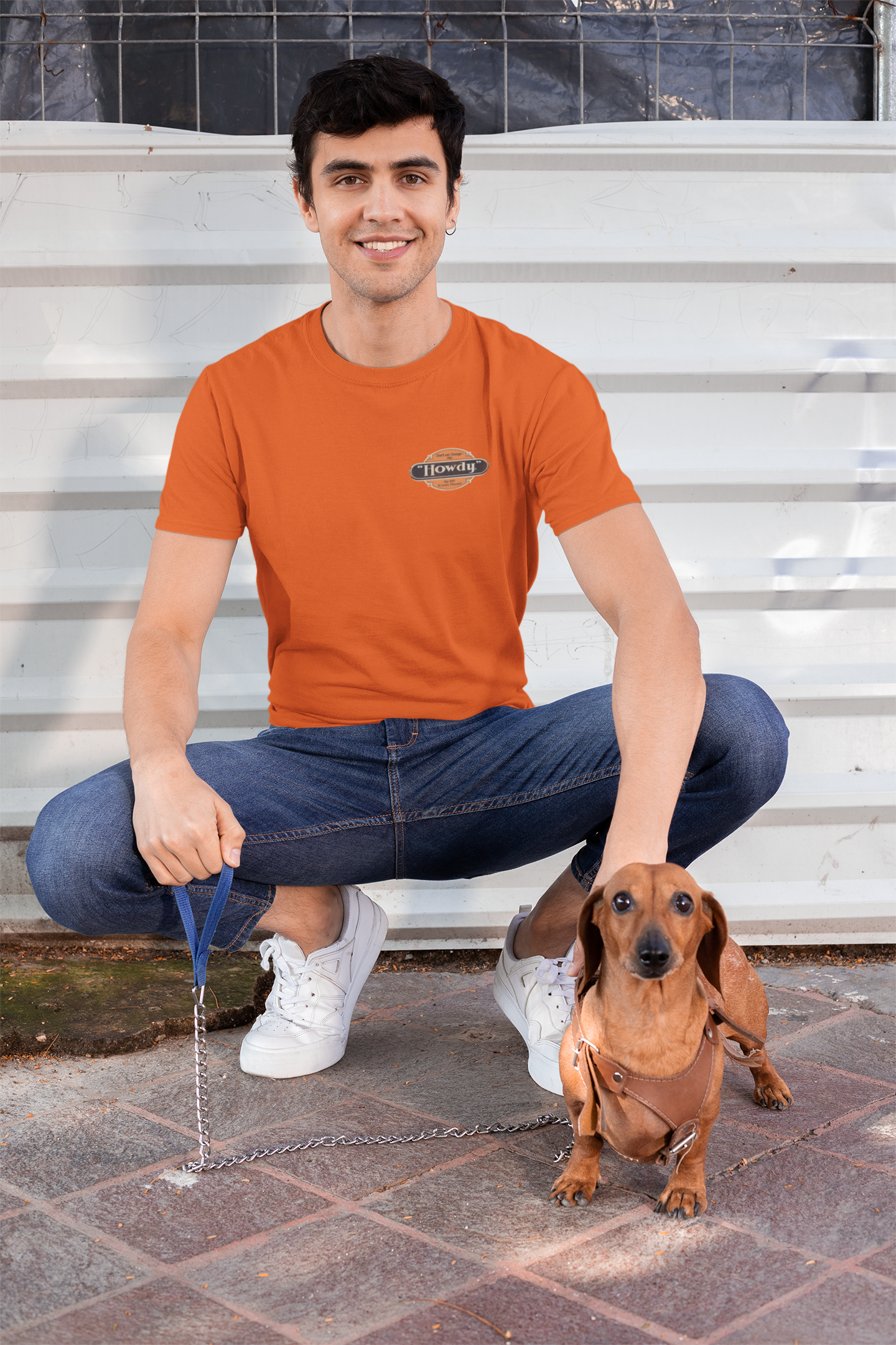 Man wearing the Howdy® Dog-Gon Good Orange Soda Tee featuring a vintage orange soda graphic on a unisex T-shirt.