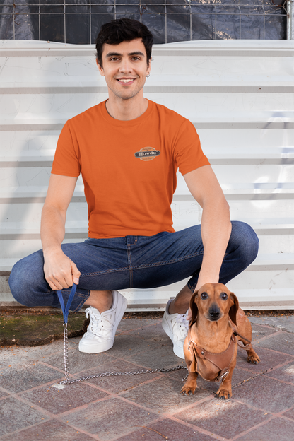 Man wearing the Howdy® Dog-Gon Good Orange Soda Tee featuring a vintage orange soda graphic on a unisex T-shirt.
