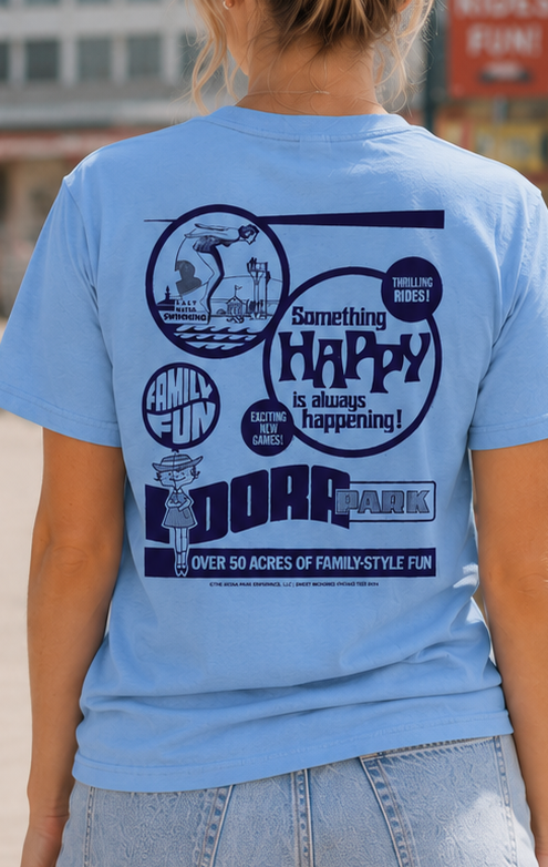 Woman wearing the officially licensed Idora Park 1930s Original Printer Block Limited Edition light blue T-shirt showing the vintage back graphic inspired by Youngstown, Ohio.