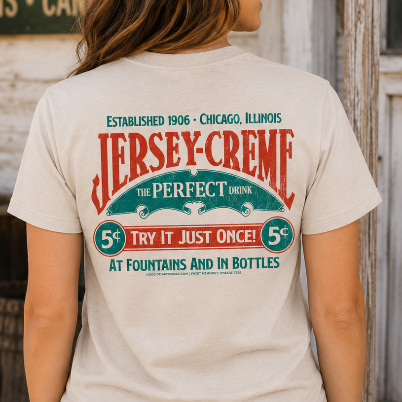 Female model wearing the Jersey Creme® The Perfect Drink Tee showcasing nostalgic Jersey Creme® artwork and classic beverage branding.
