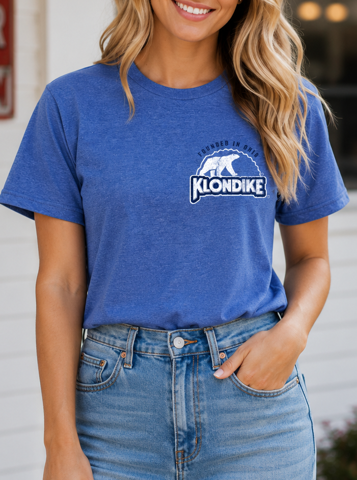 Female model wearing the Klondike® Birthplace of Klondike Ohio t-shirt featuring a retro Klondike logo on a blue heather unisex tee.