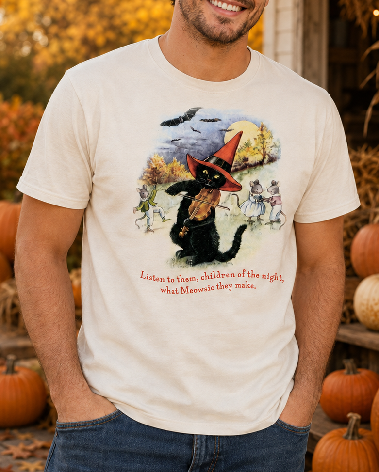Male model wearing the Meowsic of the Night Sweet Memories Halloween Exclusive tee in an autumn pumpkin setting
