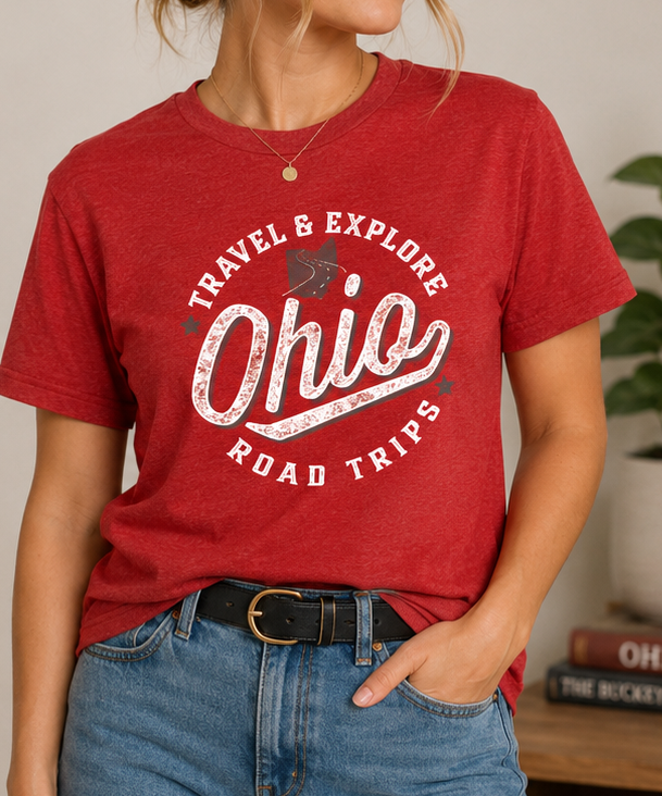 Woman wearing the Ohio Road Trips – Ohio's Top 10 Ice Cream & Sweets Trail Unisex Graphic Tee with the retro Travel & Explore Ohio front design.