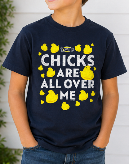 Child wearing the PEEPS® Chicks Are All Over Me Youth Graphic Tee featuring colorful PEEPS® Marshmallow Chicks.