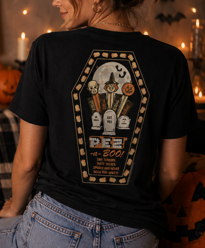 Woman wearing PEZ®-a-Boo! black Halloween T-shirt featuring vintage PEZ® candy coffin graphic on the back