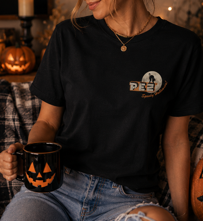 Woman wearing PEZ® Spooky Halloween black T-shirt with vintage black cat and moon left chest graphic