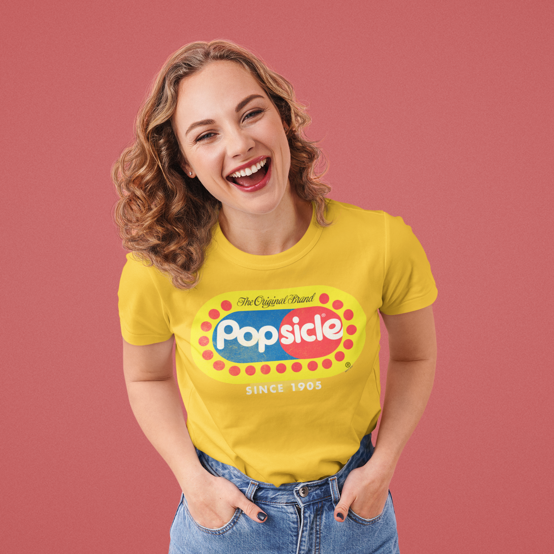 Female model wearing a Popsicle® The Original Authentic Unisex Shirt with iconic Popsicle branding and nostalgic retro graphic design.