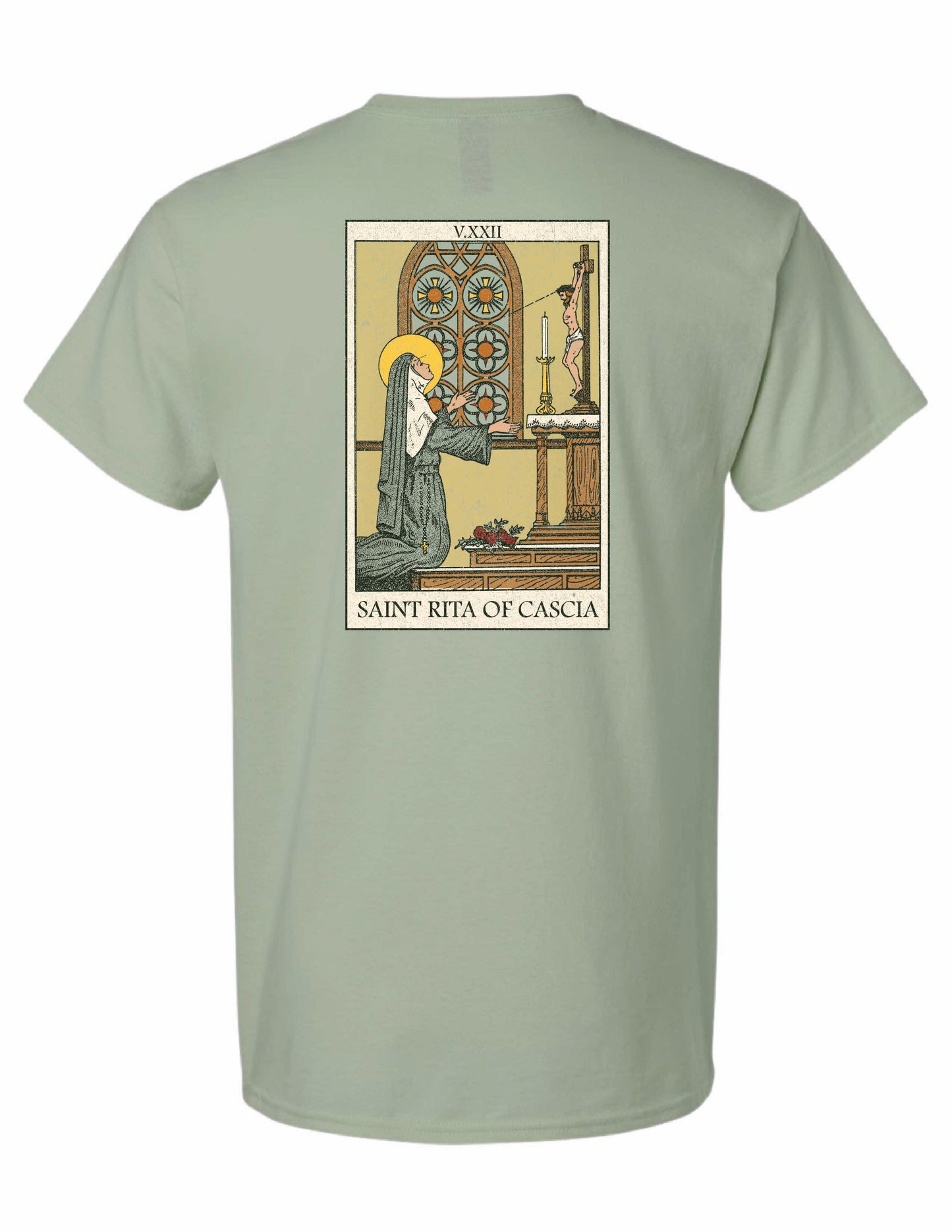 Back of the Saint Rita of Cascia unisex graphic T-shirt featuring vintage-inspired religious artwork of Saint Rita praying before the crucifix.