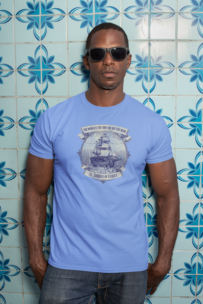 Man wearing the Saint Thérèse The World is Thy Ship religious unisex graphic T-shirt featuring inspirational Catholic artwork.