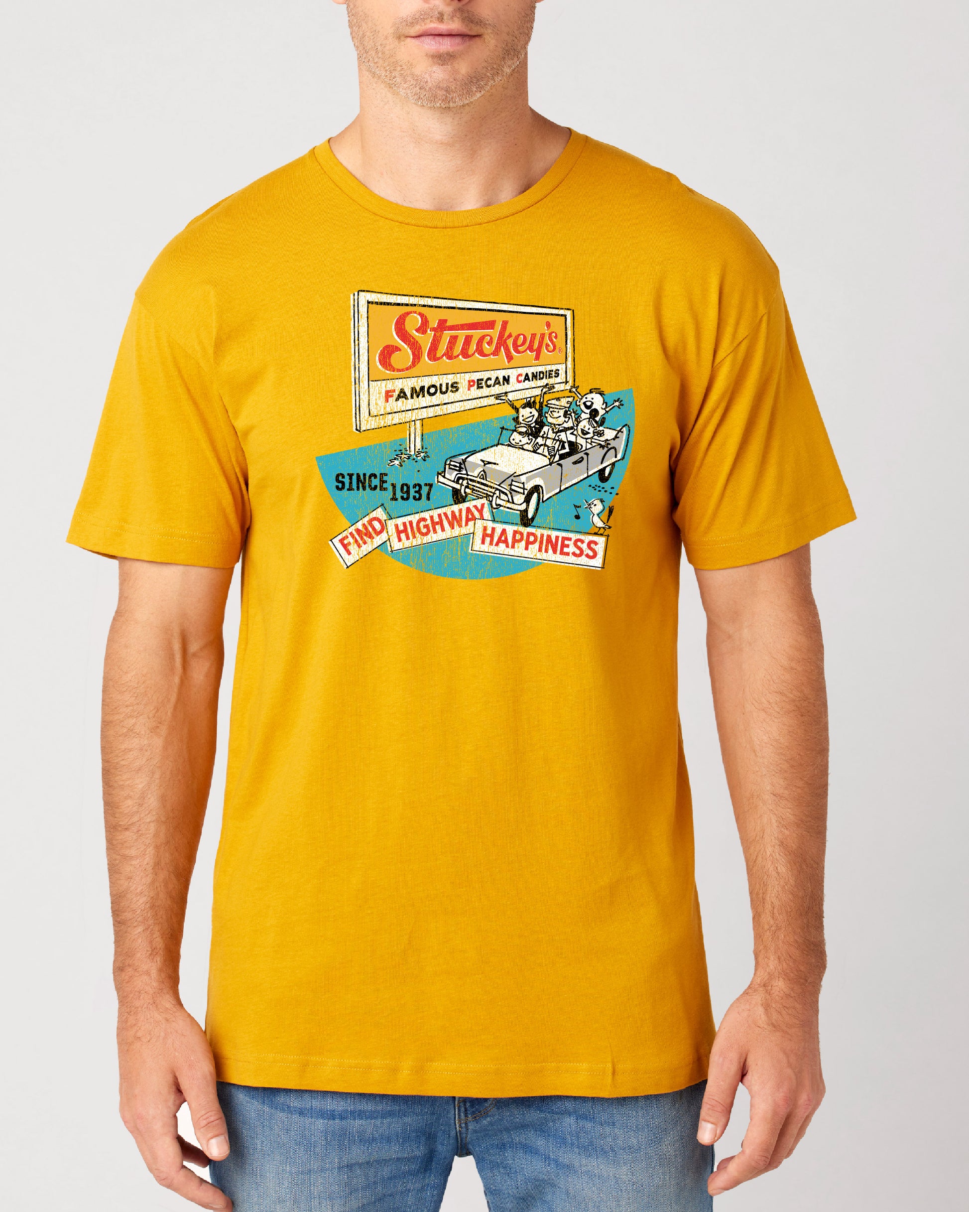 Male model wearing the Stuckey's® Find Highway Happiness Tee, an officially licensed vintage-inspired travel and Americana graphic shirt.