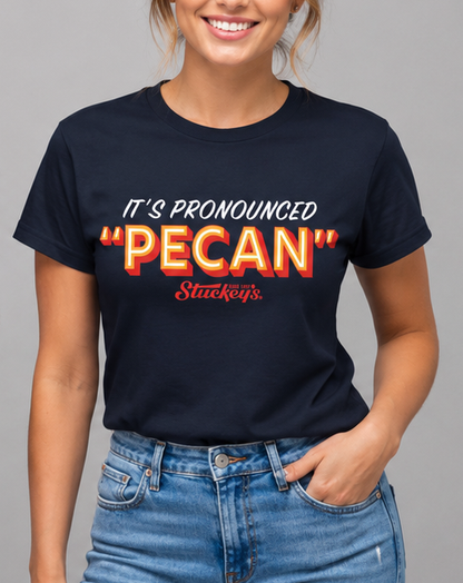 Female model wearing the Stuckey's® It's Pronounced 'Pecan' Tee featuring nostalgic Stuckey's branding and Southern-inspired artwork.