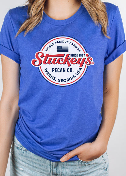 Female model wearing the Stuckey's® Made in the USA Tee, officially licensed unisex graphic shirt featuring classic Stuckey's Americana artwork.