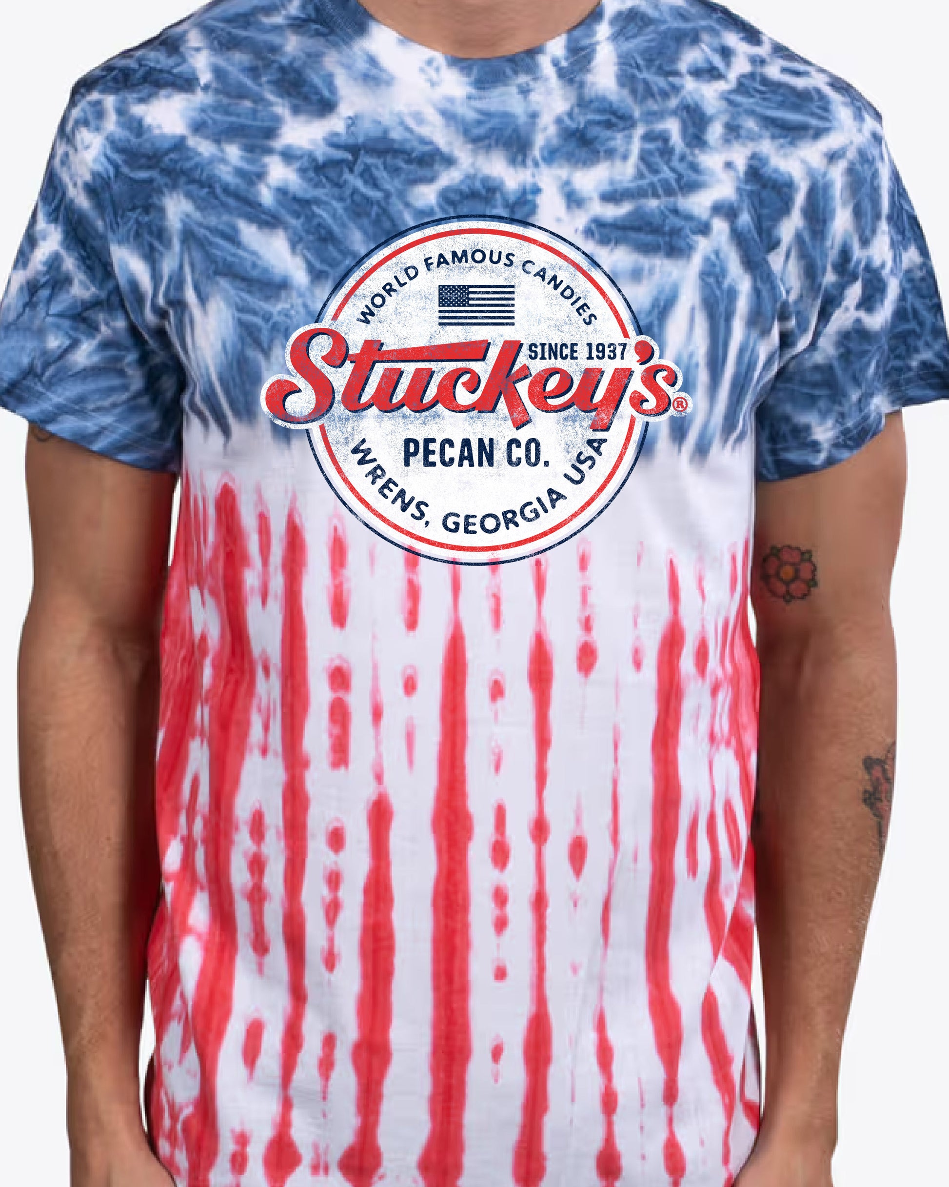 Man wearing the Stuckey's® Made in the USA Tie-Dye Tee inspired by classic American road trips and Southern nostalgia.