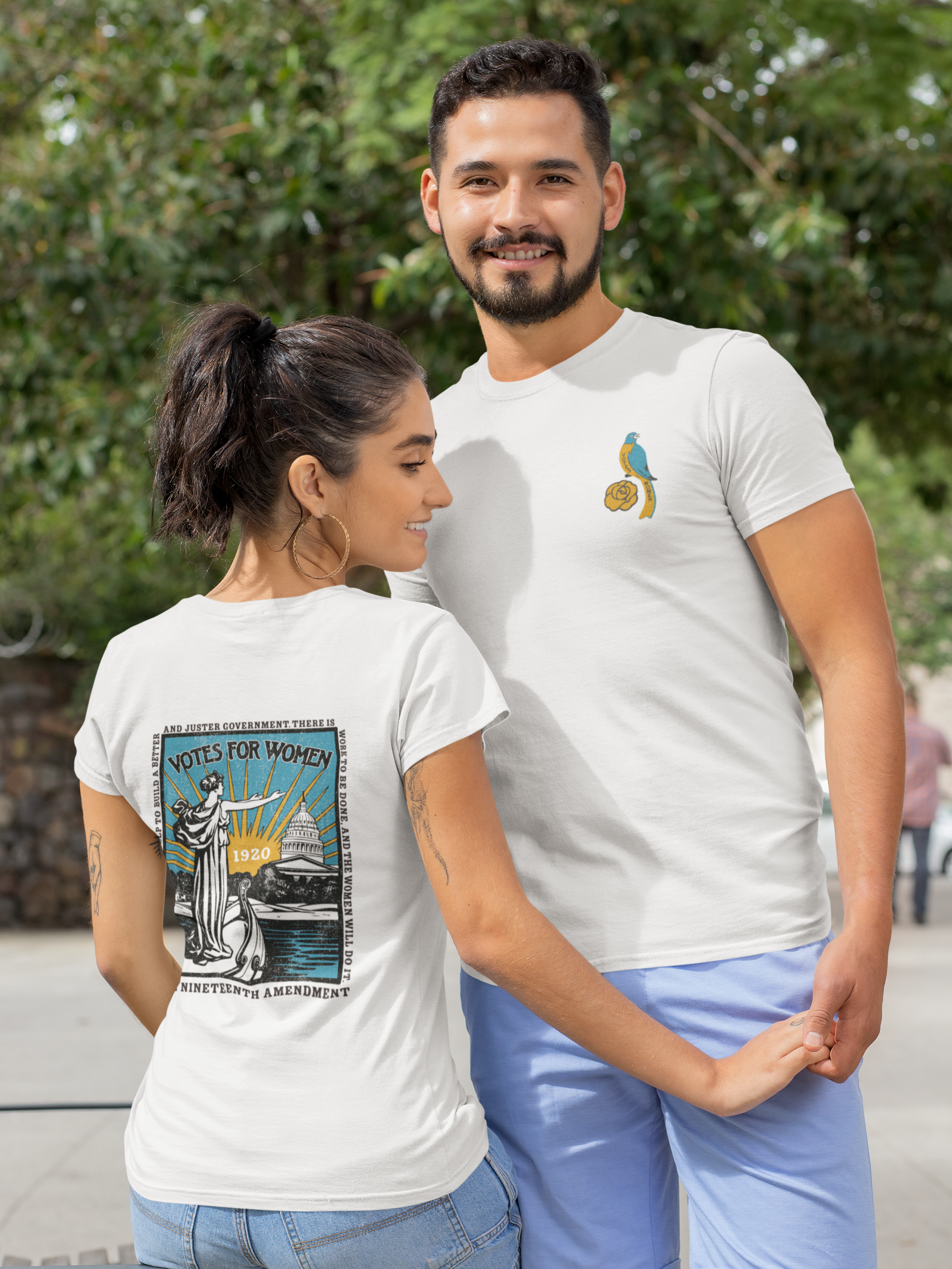 Male and female models wearing the Votes For Women Sweet Memories Exclusive Tee featuring exclusive vintage women's suffrage-inspired artwork.