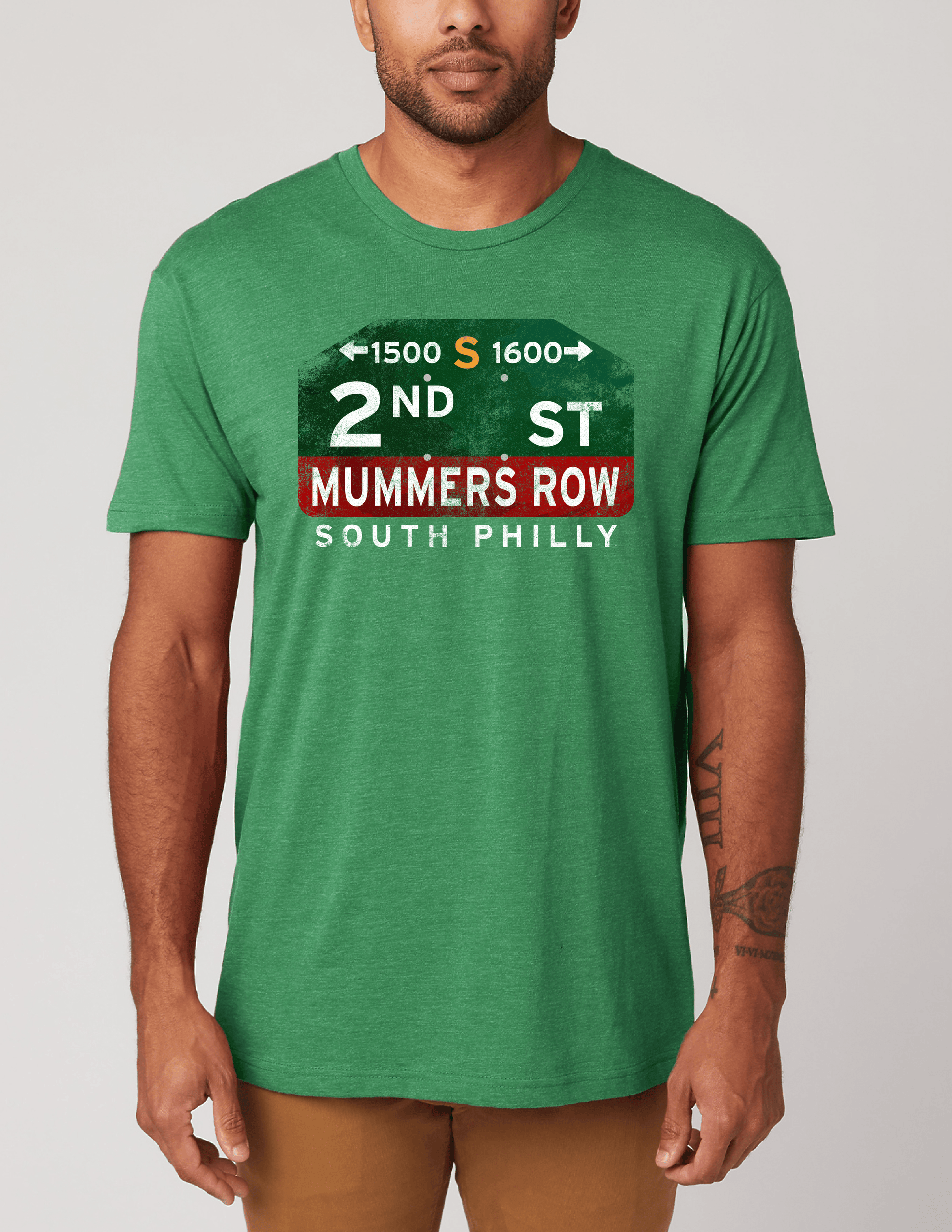 Man wearing the 2nd Street Mummers Row Philadelphia Unisex Tee featuring a nostalgic Mummers Parade graphic.