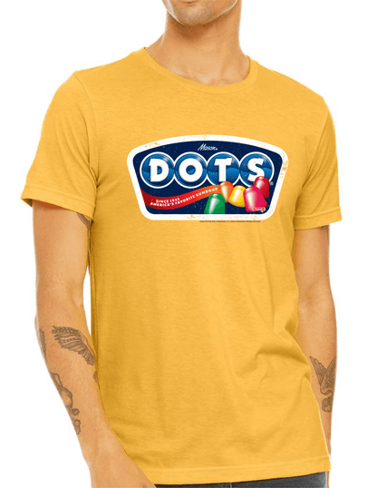 Model wearing the DOTS® Retro Gumdrops Unisex Graphic T-Shirt featuring colorful vintage-inspired candy artwork and a nostalgic retro DOTS® logo design.