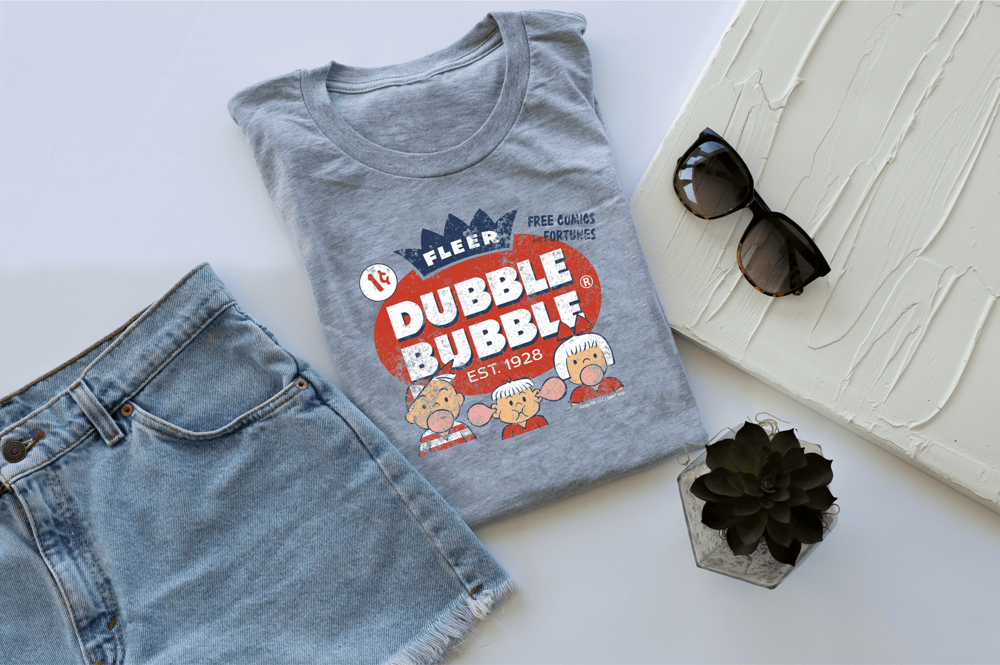 close up of dubble bubble fleer free comics and fortunes vintage bubble gum graphic on soft cotton t shirt