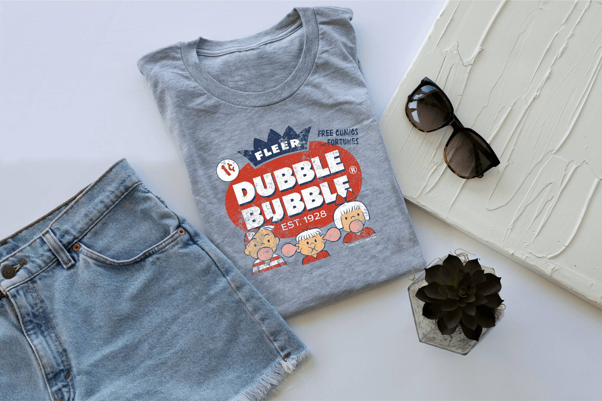 close up of dubble bubble fleer free comics and fortunes vintage bubble gum graphic on soft cotton t shirt