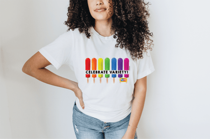 Female model wearing a Popsicle® Celebrate the Rainbow Official Popsicle® Graphic T-Shirt with vibrant rainbow-inspired Popsicle artwork and nostalgic frozen treat design.