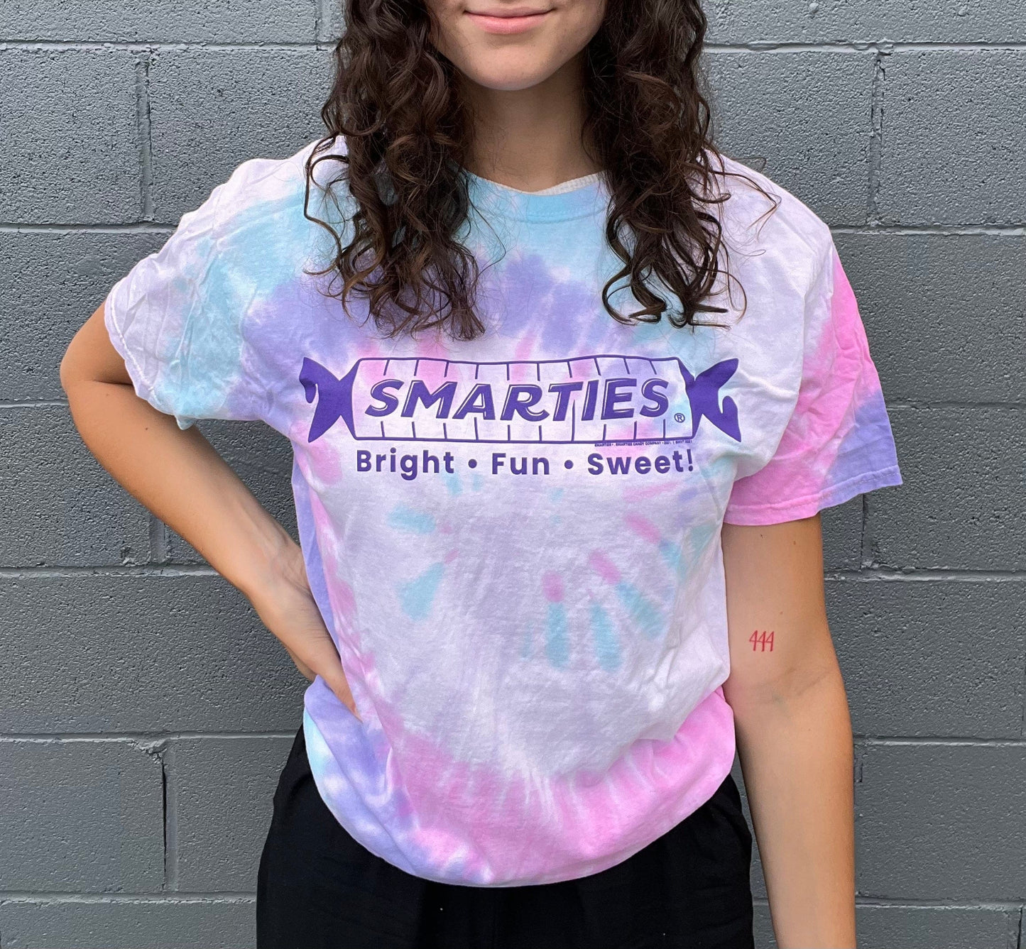 unisex smarties tie dye shirt styled casually colorful candy lover outfit with retro candy branding